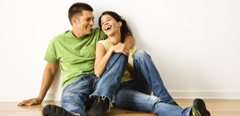 young couple sitting on floor